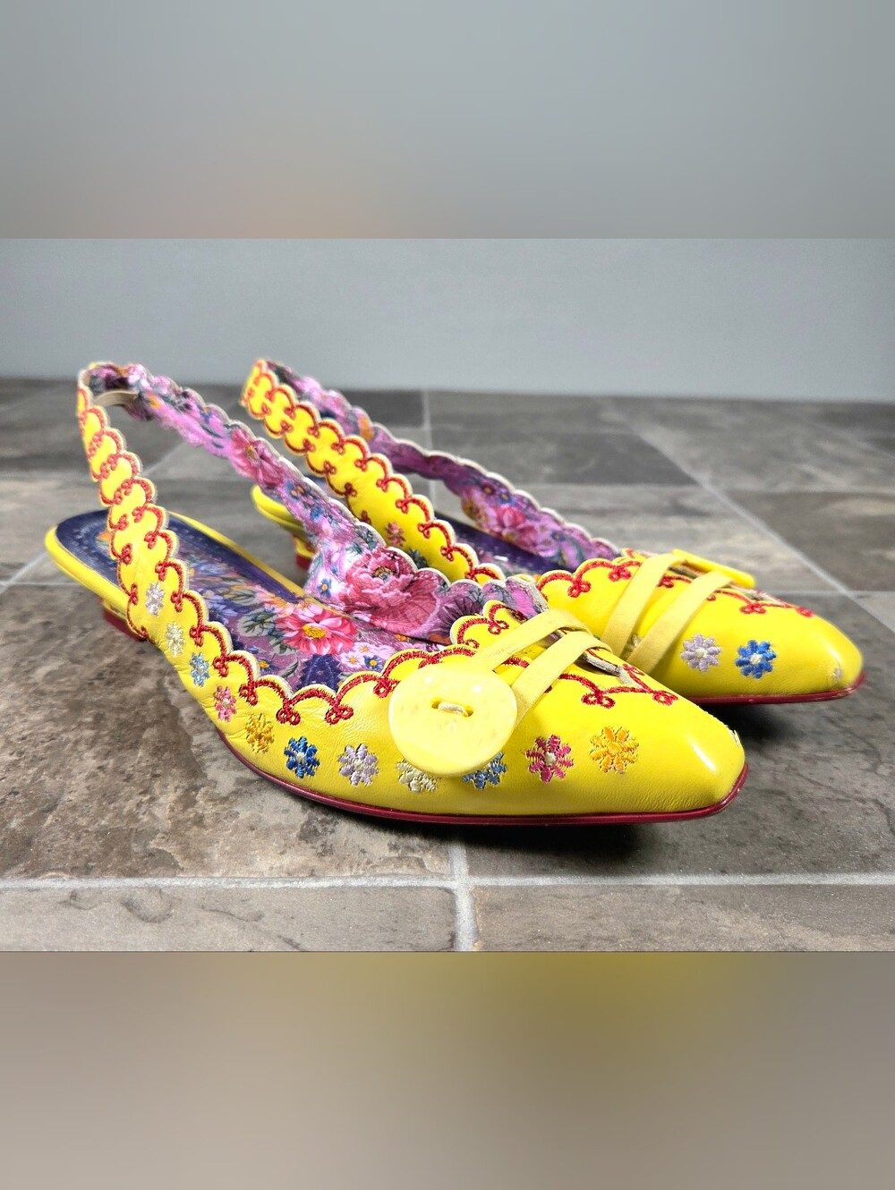 IRREGULAR CHOICE EMBROIDERED FLORAL WEDGE SLINGBACK KITTEN HEELS.